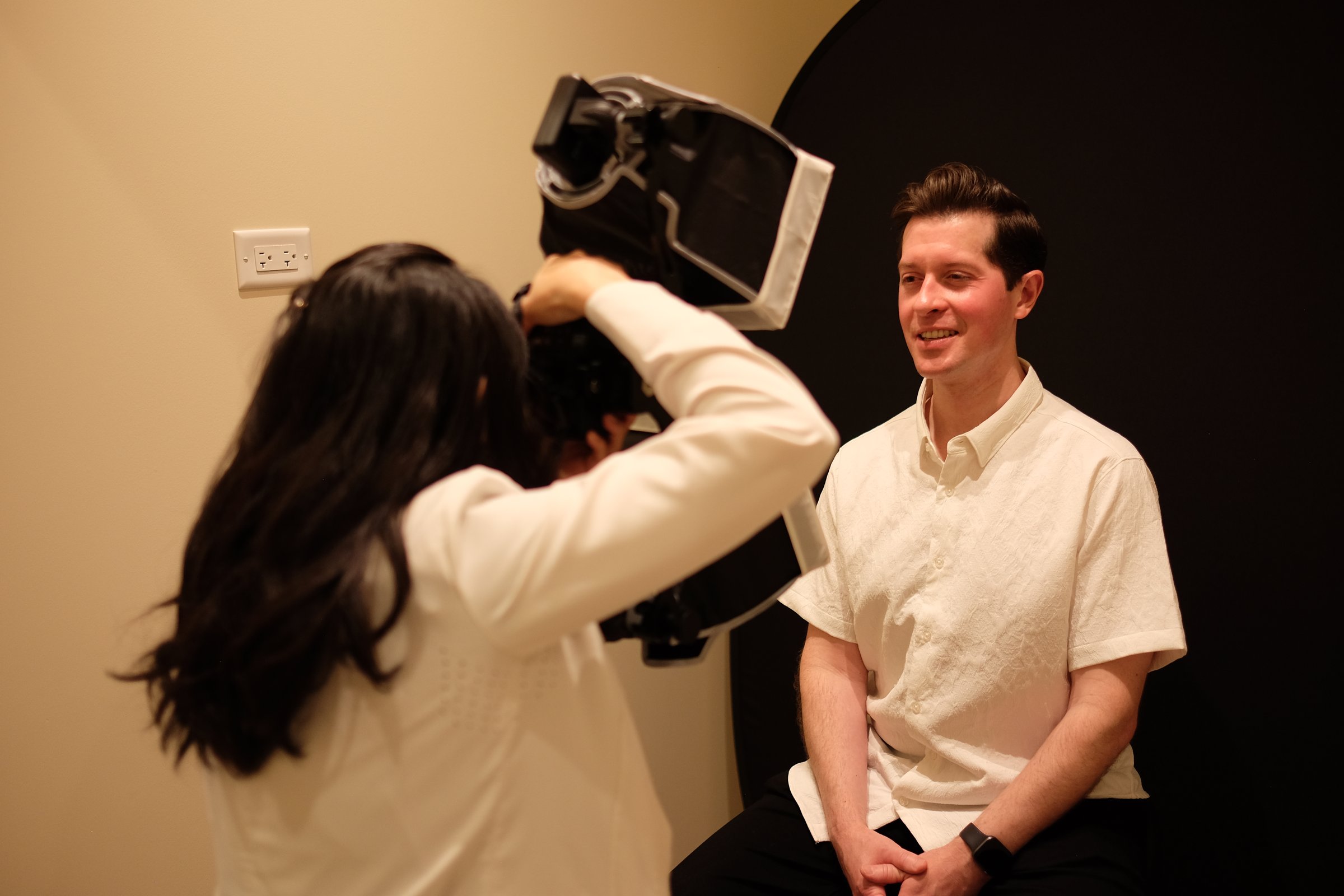 Dr. Erin Cho photographing a patient's smile