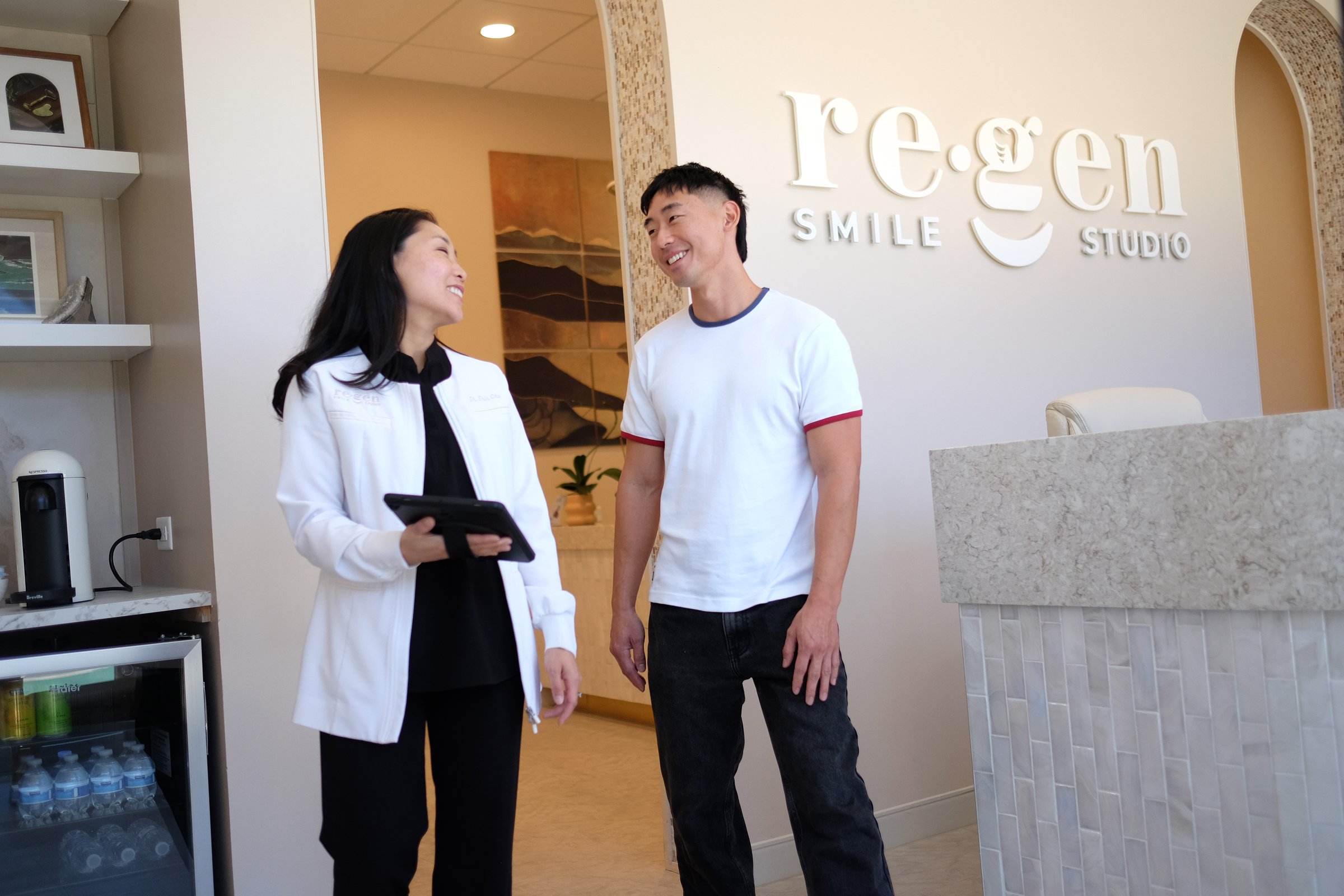 Dr. Erin Cho and a patient talking by the reception desk